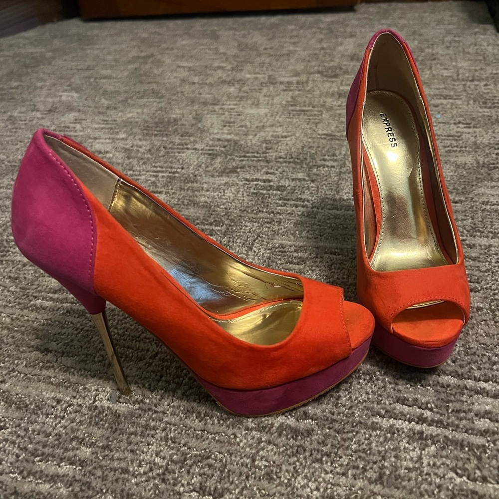 Express hot pink and orange suede stiletto peep toe pumps.
